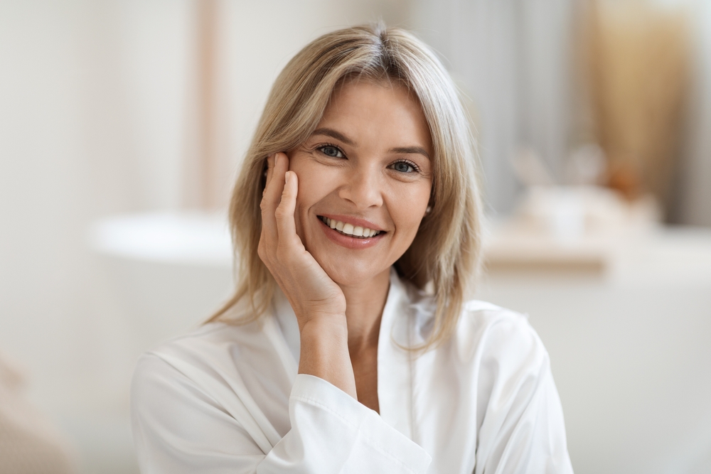 Woman with a natural smile embodying healthy aging and wellness