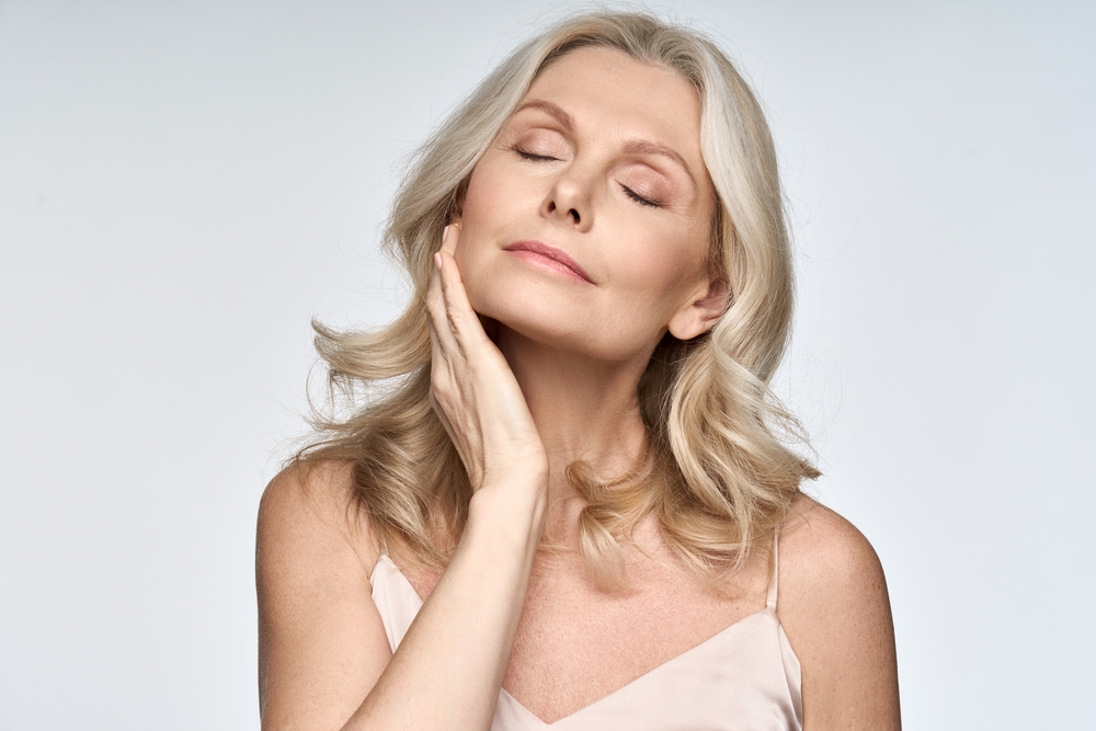 Woman with serene expression enjoying longevity optimization results