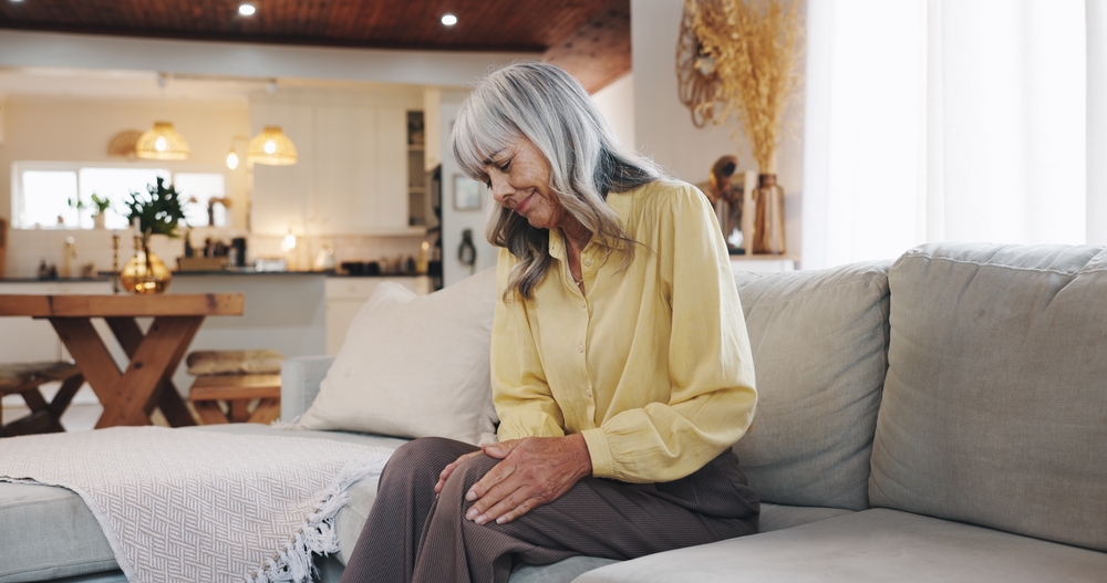 Therapist guiding a patient through non-surgical joint disease therapy exercises