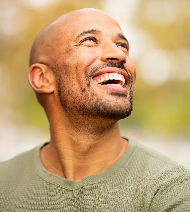Man relaxing outdoors after receiving ethically sourced biologic treatments