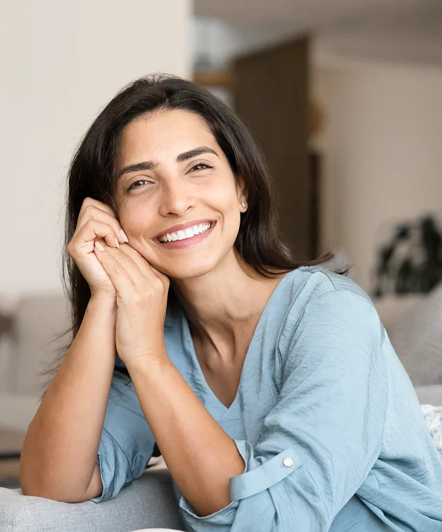 Woman with a bright smile after regenerative aesthetics care