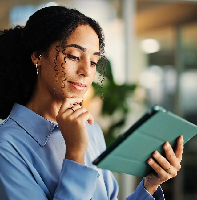 Woman thoughtfully studying evidence-based wellness research