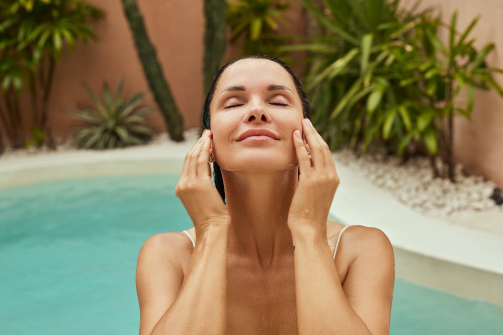 Woman standing peacefully outdoors embracing healthy aging and vitality
